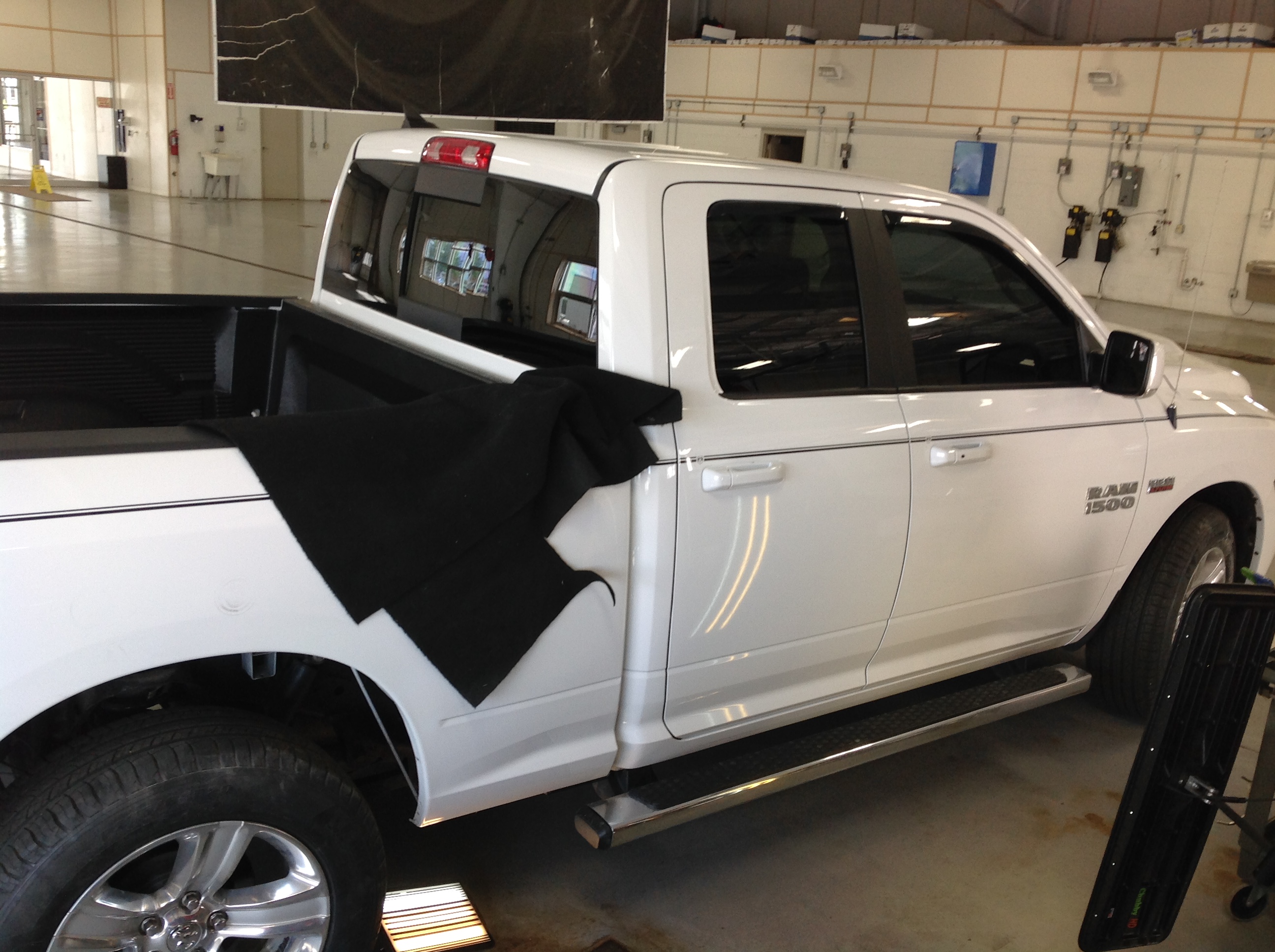 2014 White Ram 1500. removal of rear inner wheel well. For Pdr access. For more information about "paintless dent removal" contact Michael Bocek at 217dent.com.
