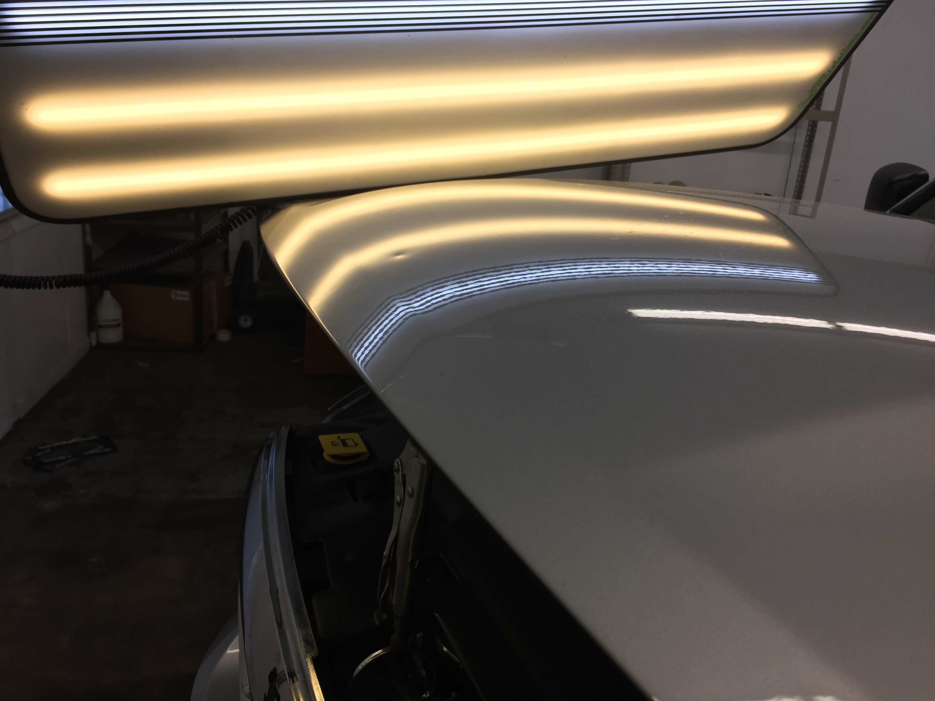 2015 Dodge Ram hail damage on hood, paintless dent repair, Springfield, IL. http://217dent.com by Michael Bocek