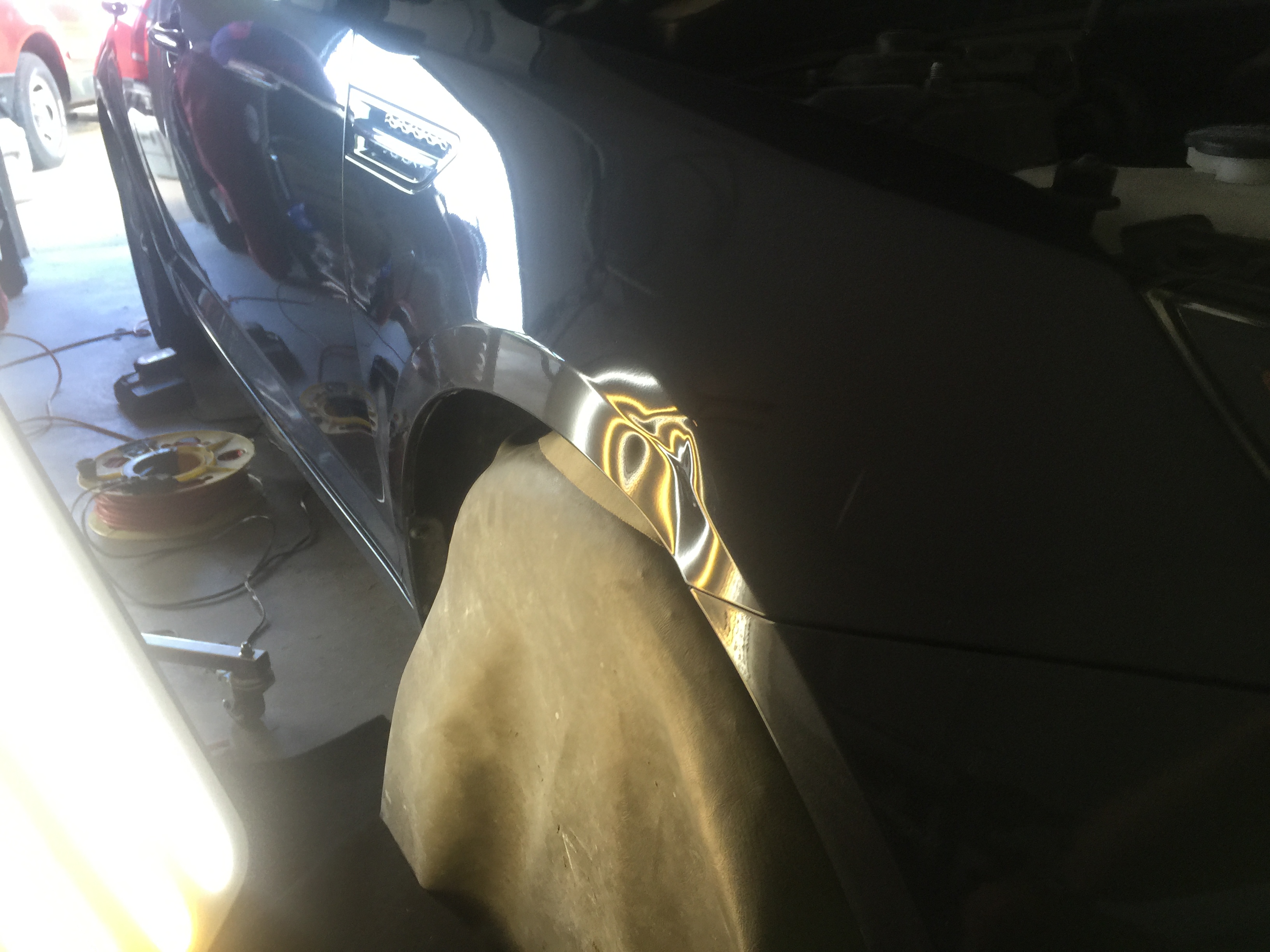 2011 Kia Optima Fender dent repair, with paintless dent removal process, large dent repair, in Springfield, IL. http://217dent.com