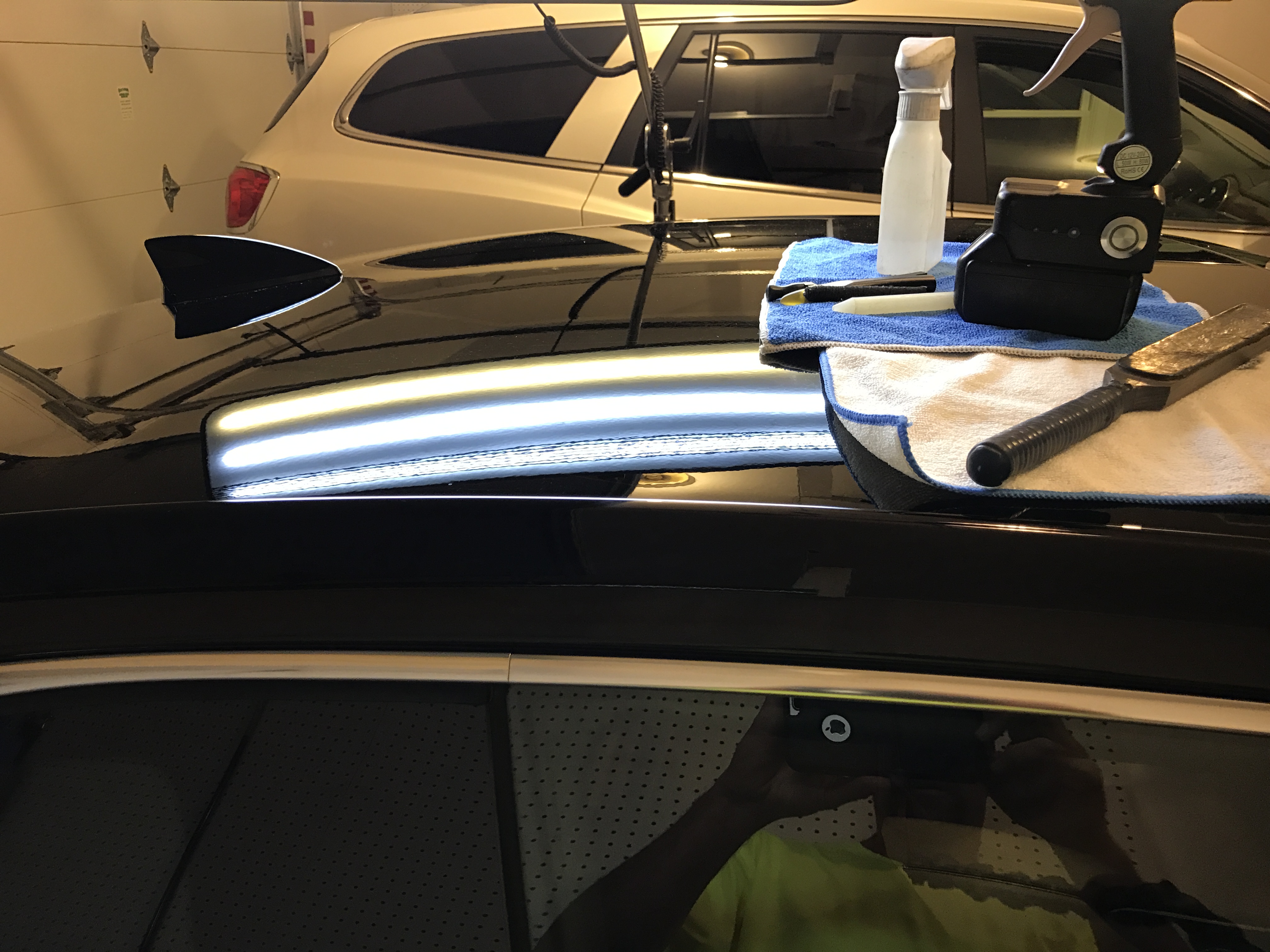 Acorn Damage on roof of this 2016 Cadillac ATS under the inspection lights of the Paintless dent removal process. Michael Bocek out of Springfield, IL was able to remove this dent with ease. http://217Dent.com After Image
