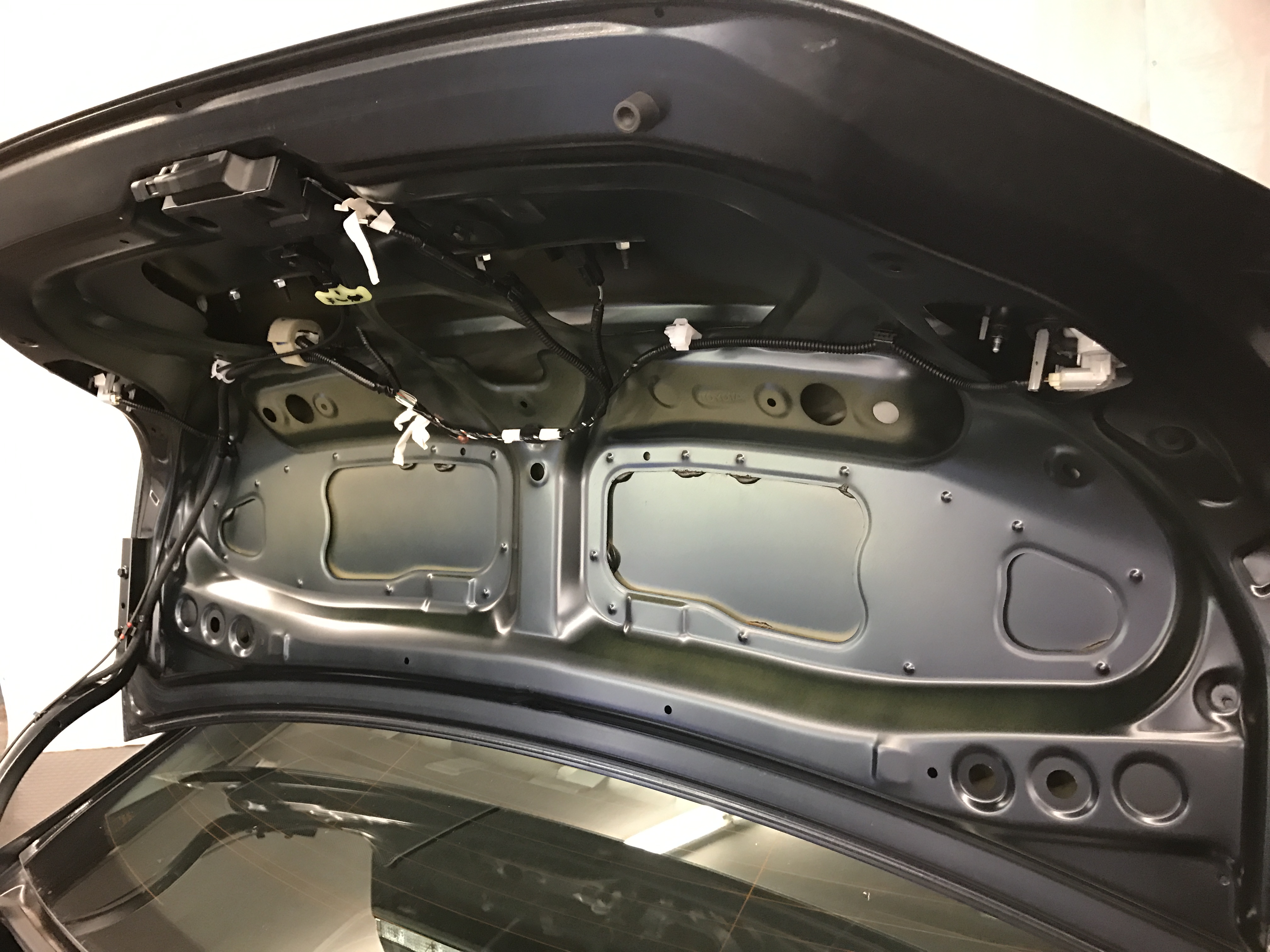 2011 Toyota Camry, after the interior liner was removed, the bracing and the access exposed on the deck lid. http://217Dent.com