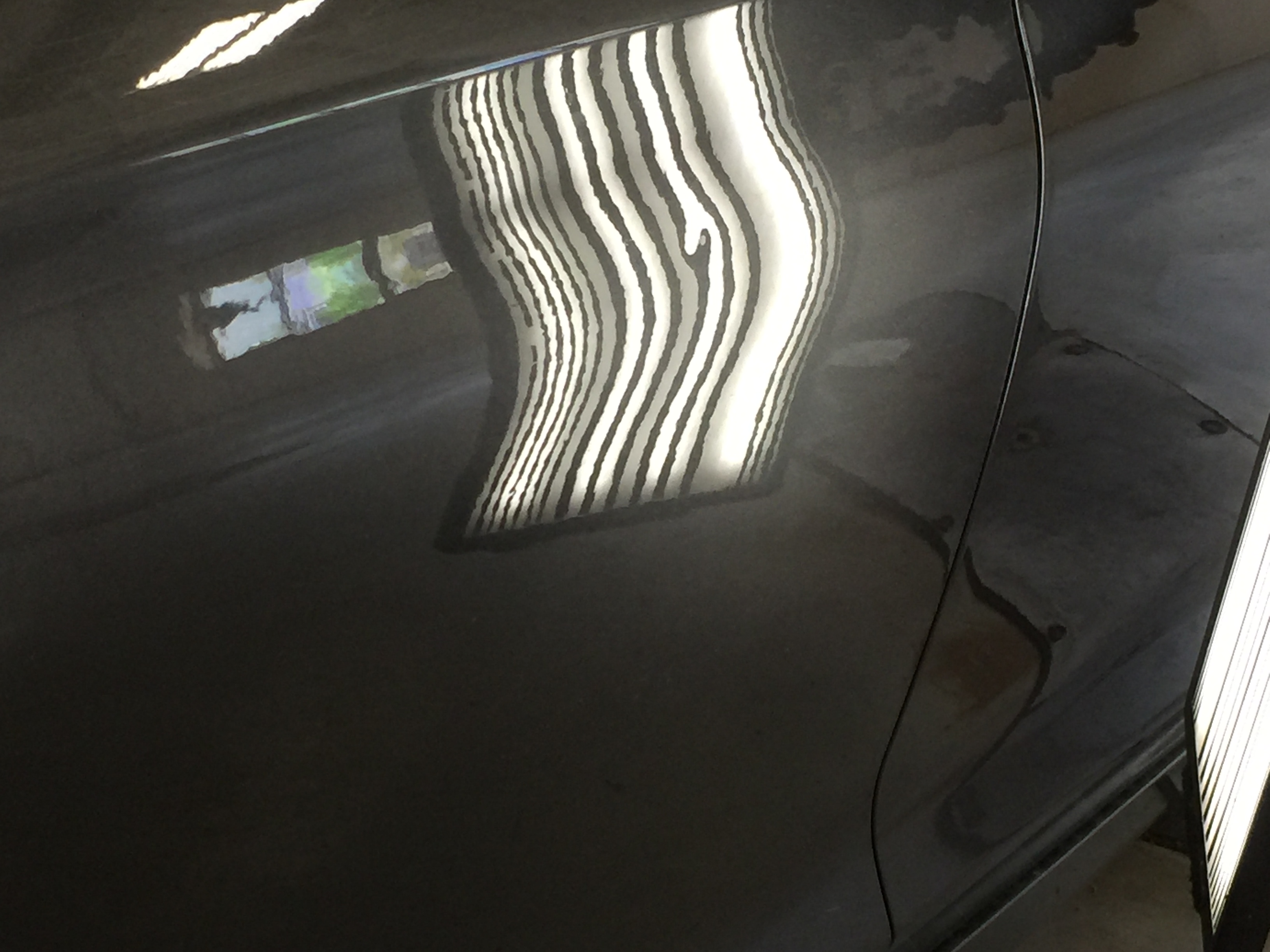 2015 Chrysler 200 Gray Metallic | Dent Removal On Passenger Side Rear Door. Work was done by Michael Bocek from 217dent.com. Go to https://217dent.com an estimate, or for more information about paintless dent removal
