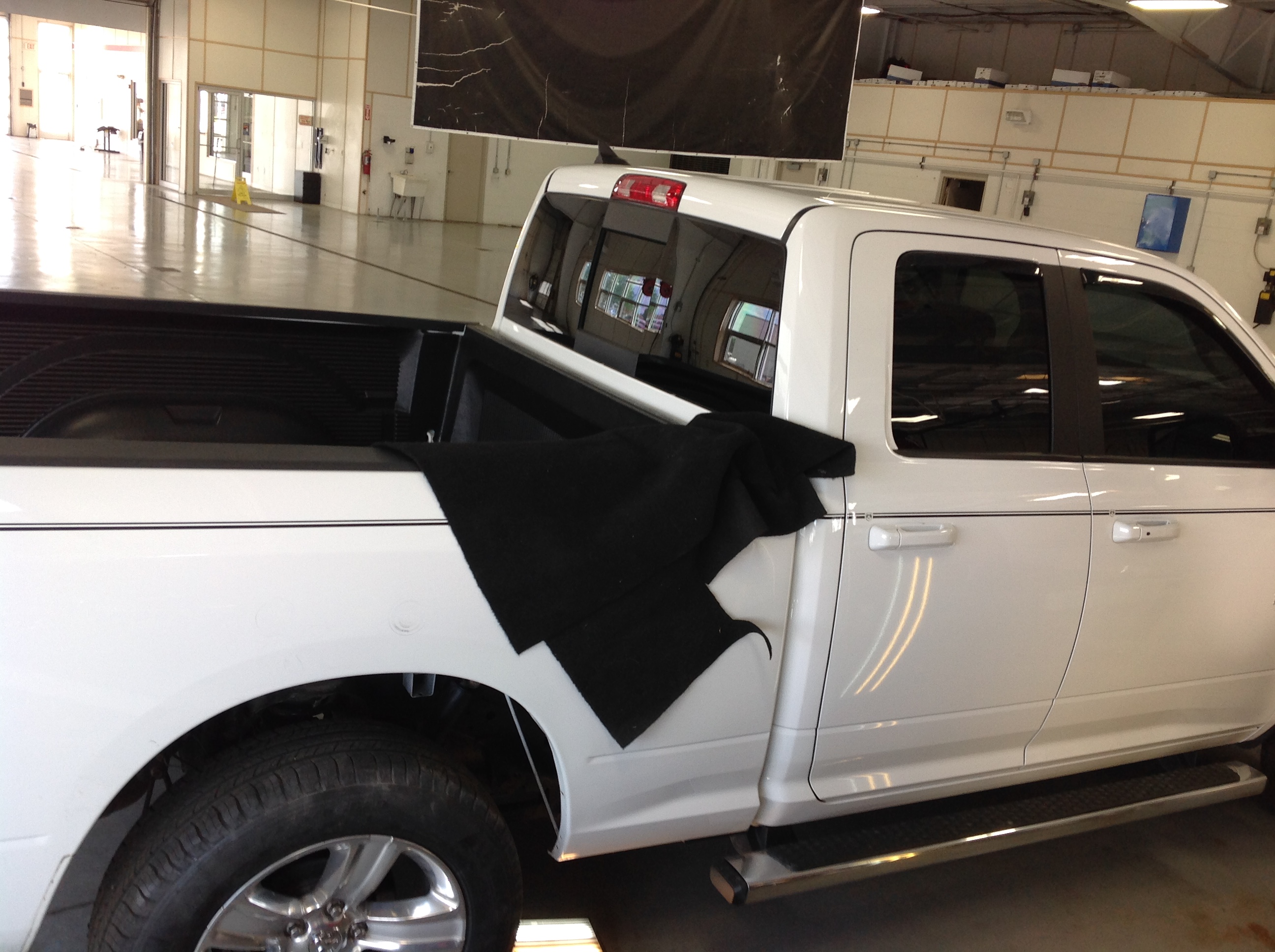 2014 White Ram 1500. removal of rear inner wheel well. For Pdr access. For more information about "paintless dent removal" contact Michael Bocek at 217dent.com.