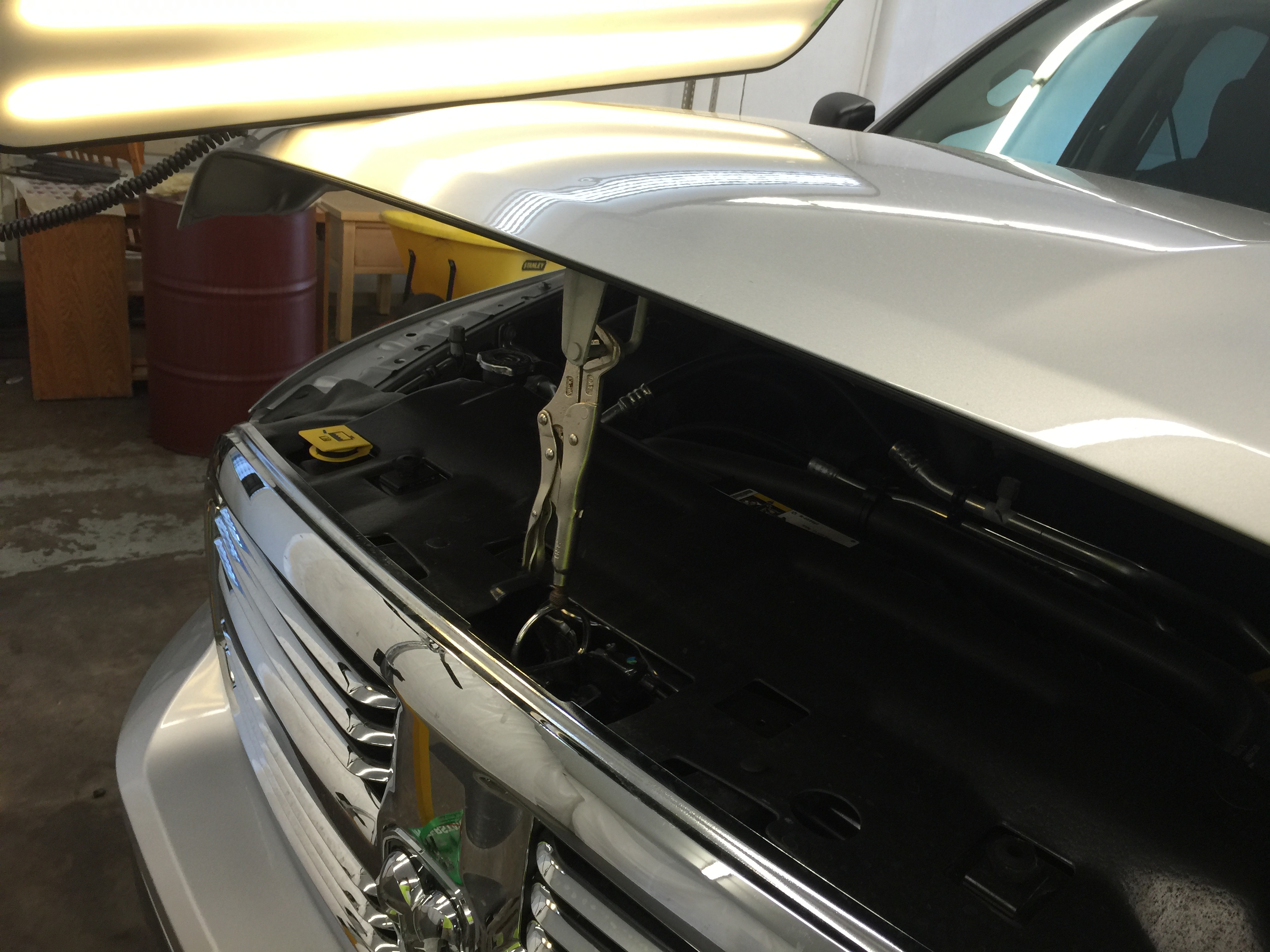 2015 Dodge Ram hail damage on hood, paintless dent repair, Springfield, IL. https://217dent.com by Michael Bocek