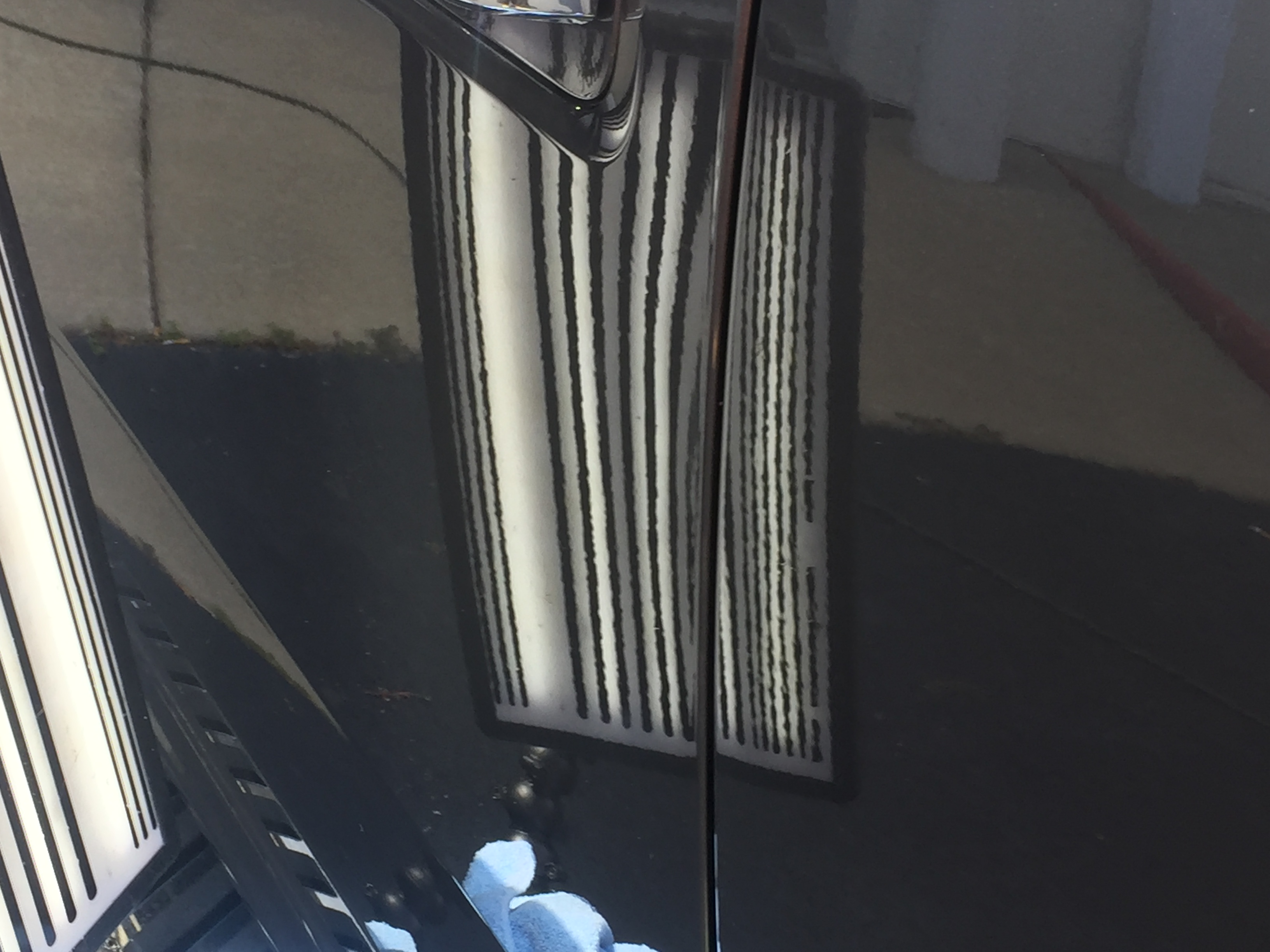 www.217dent.com 2015 Grey Aluminum Ford F-150 driver's side door dent removal near door-handle.