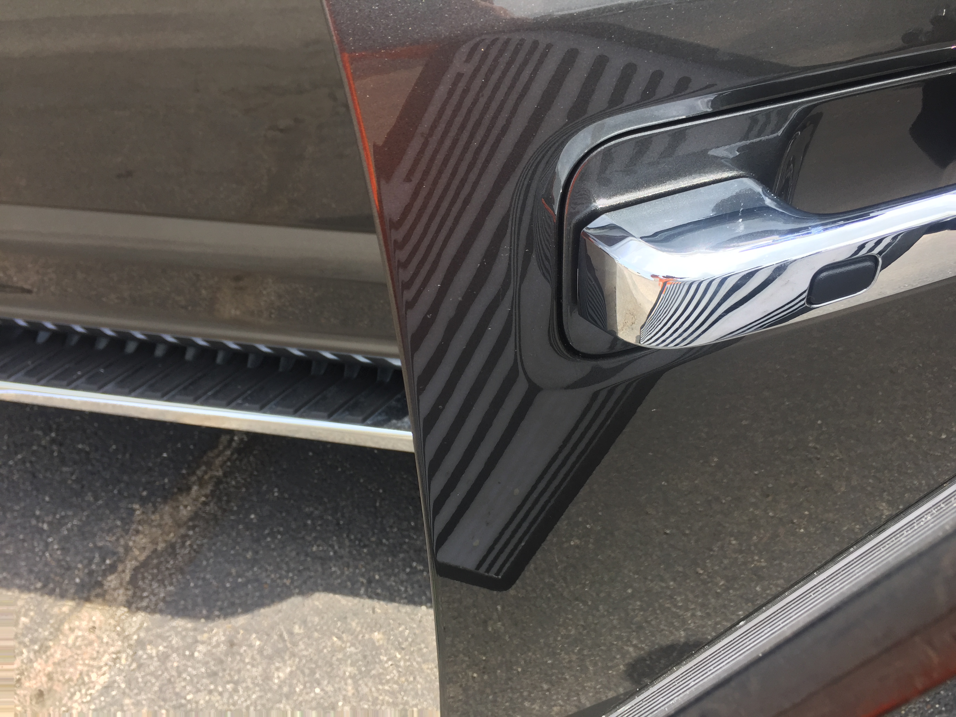 www.217dent.com 2015 Grey Aluminum Ford F-150 passenger side door dent removal near door-handle.