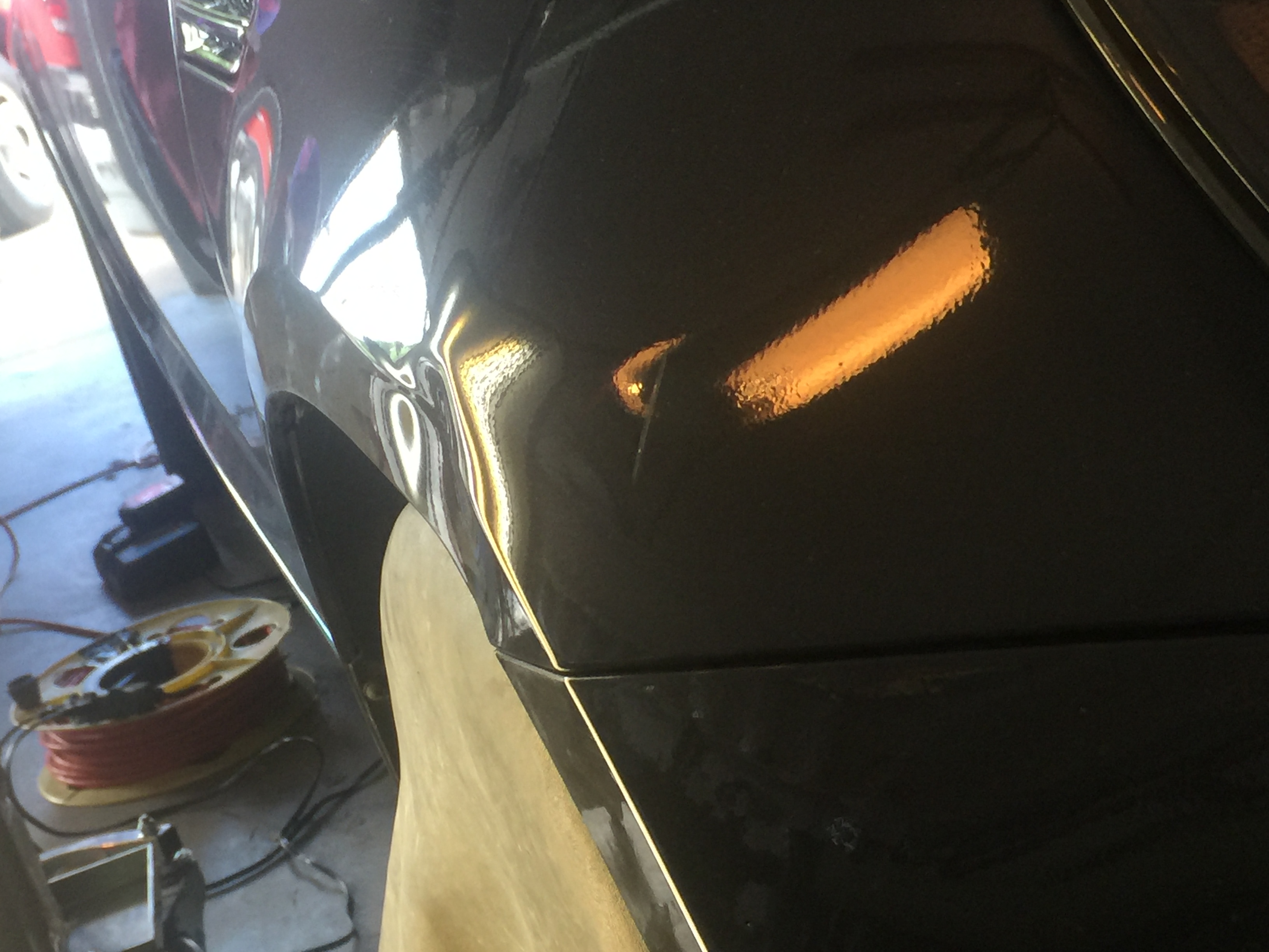 2011 Kia Optima Fender dent repair, with paintless dent removal process, large dent repair, in Springfield, IL. https://217dent.com