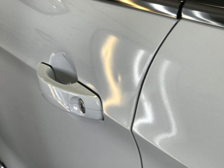 2016 Ford Escape: dents in the driver's door, before paintless dent repair