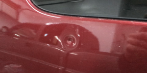 Springfield, IL Dent repair, http://217Dent.com Photo of a sharp dent in the rear quarter of a 2010 Yukon. (Before Image)