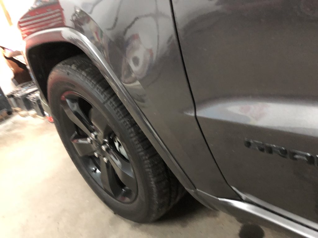Large dent in the fender of this Grand Cherokee, Before the paintless dent removal process was performed by Michael Bocek out of Springfield, IL http://217Dent.com