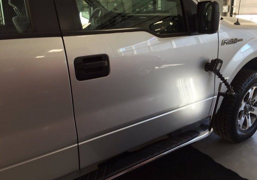 2013 Ford F-150 passenger door body-line dent, mobile Springfield dent Repair by Michael Bocek in Springfield IL, At Dealership Http://217hail.com http://217dent.com